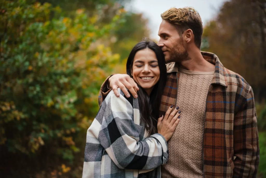 beautiful happy couple smiling and hugging while s utc
