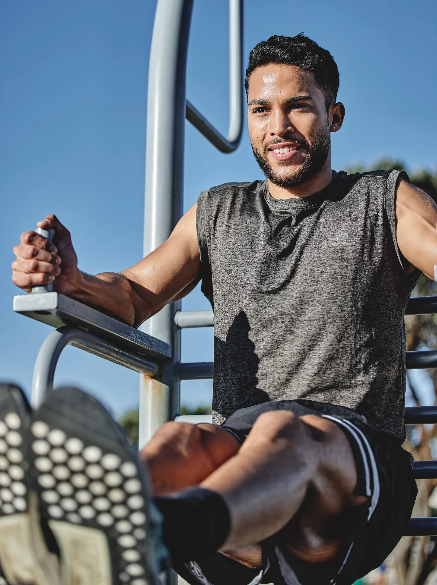 man exercising on an outdoor gymnastic apparatus utc