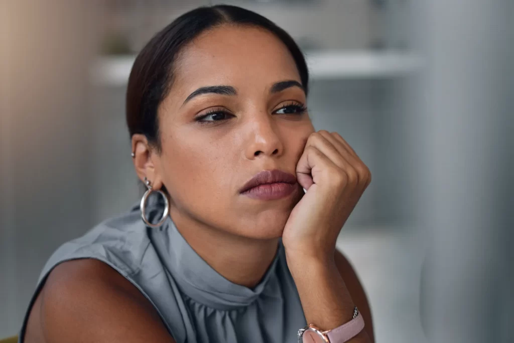 woman with pensive expression at the office utc